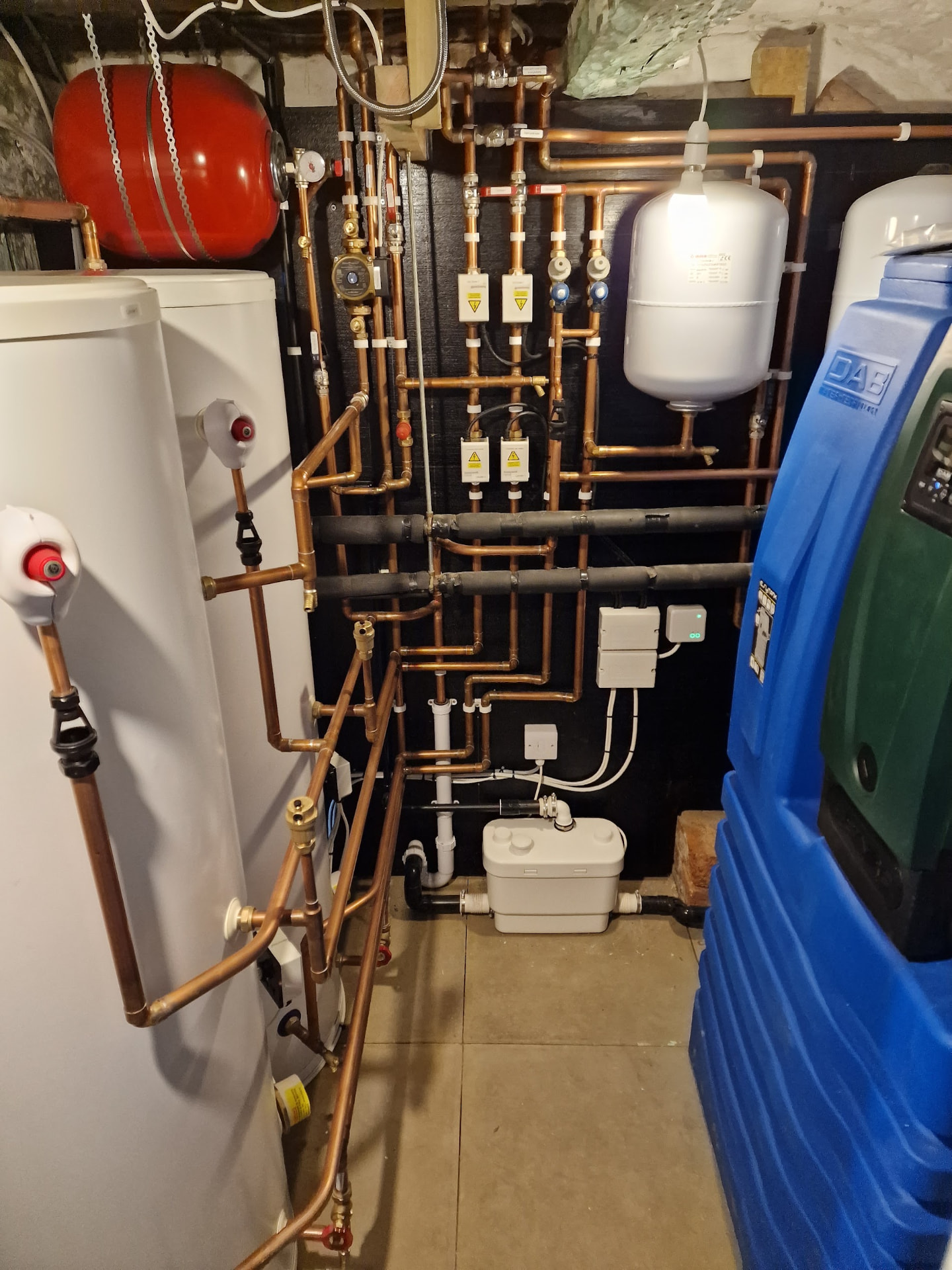 Cellar plant room with unvented cylinder, DAB mains booster, softener & dense copper manifold