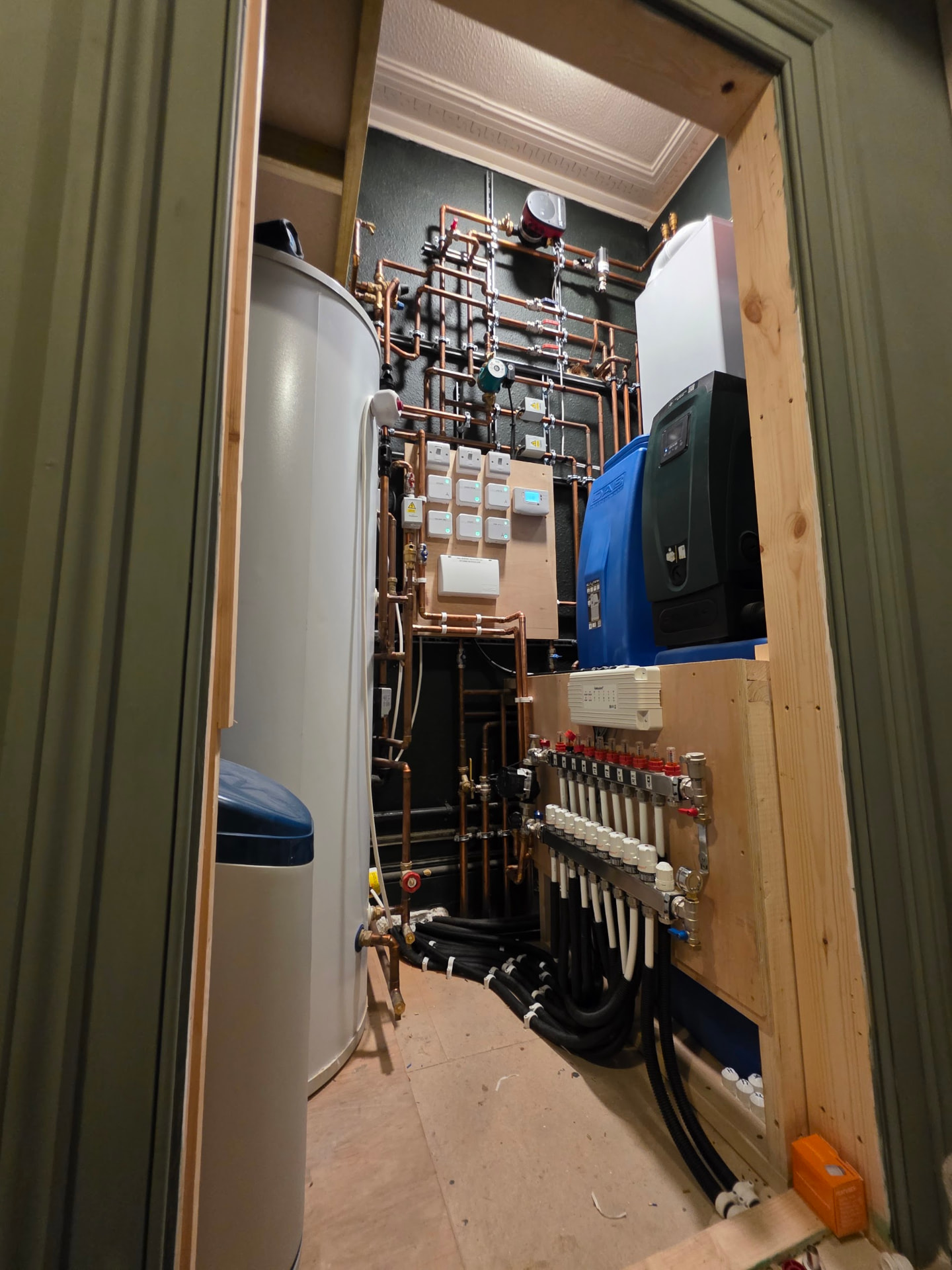 Complete UFH plant-room: boiler, unvented cylinder, softener, DAB booster & zoned manifold