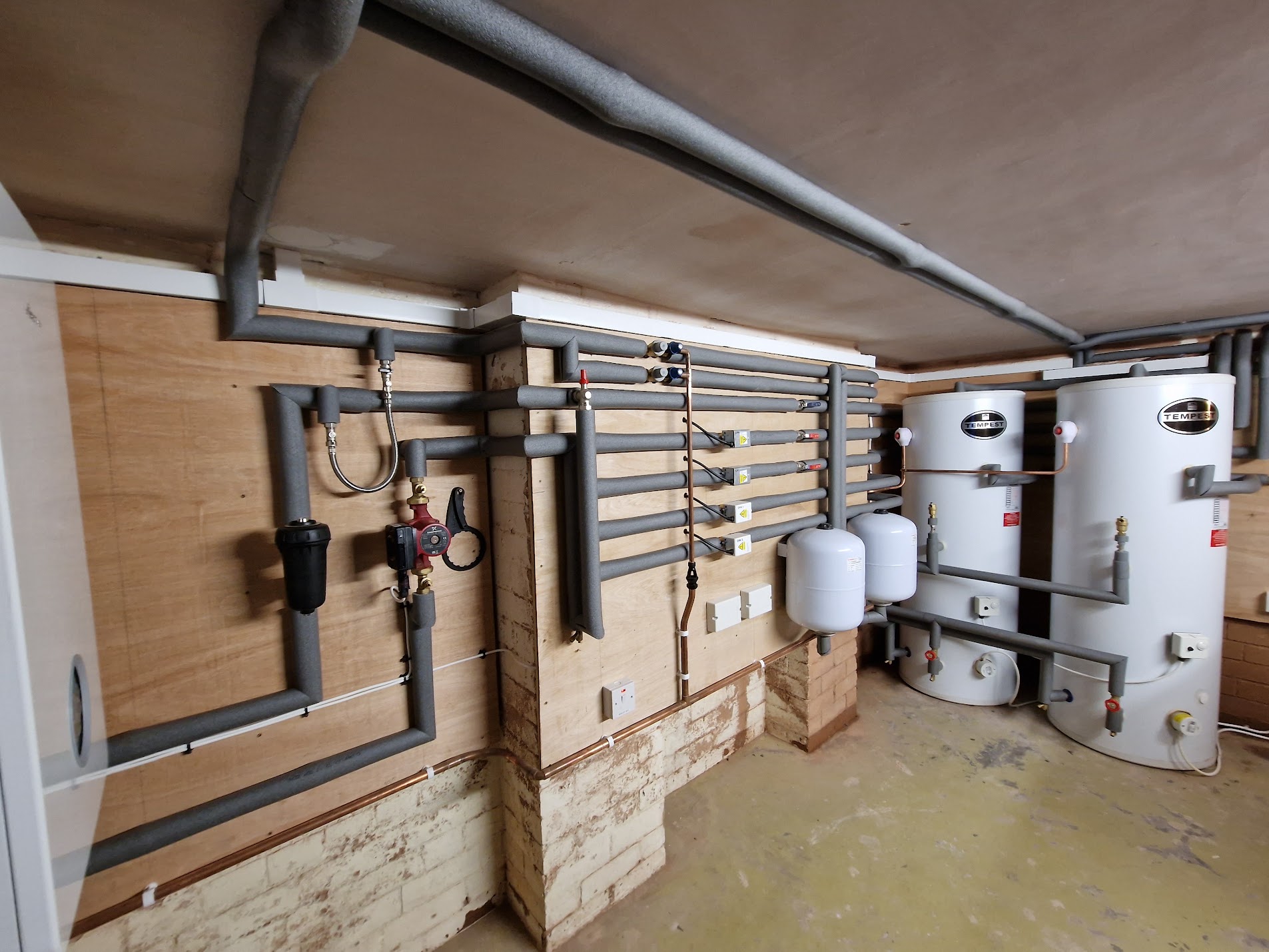 Twin Telford Tempest cylinders in a utility plant room with insulated pipework, Stratford-upon-Avon