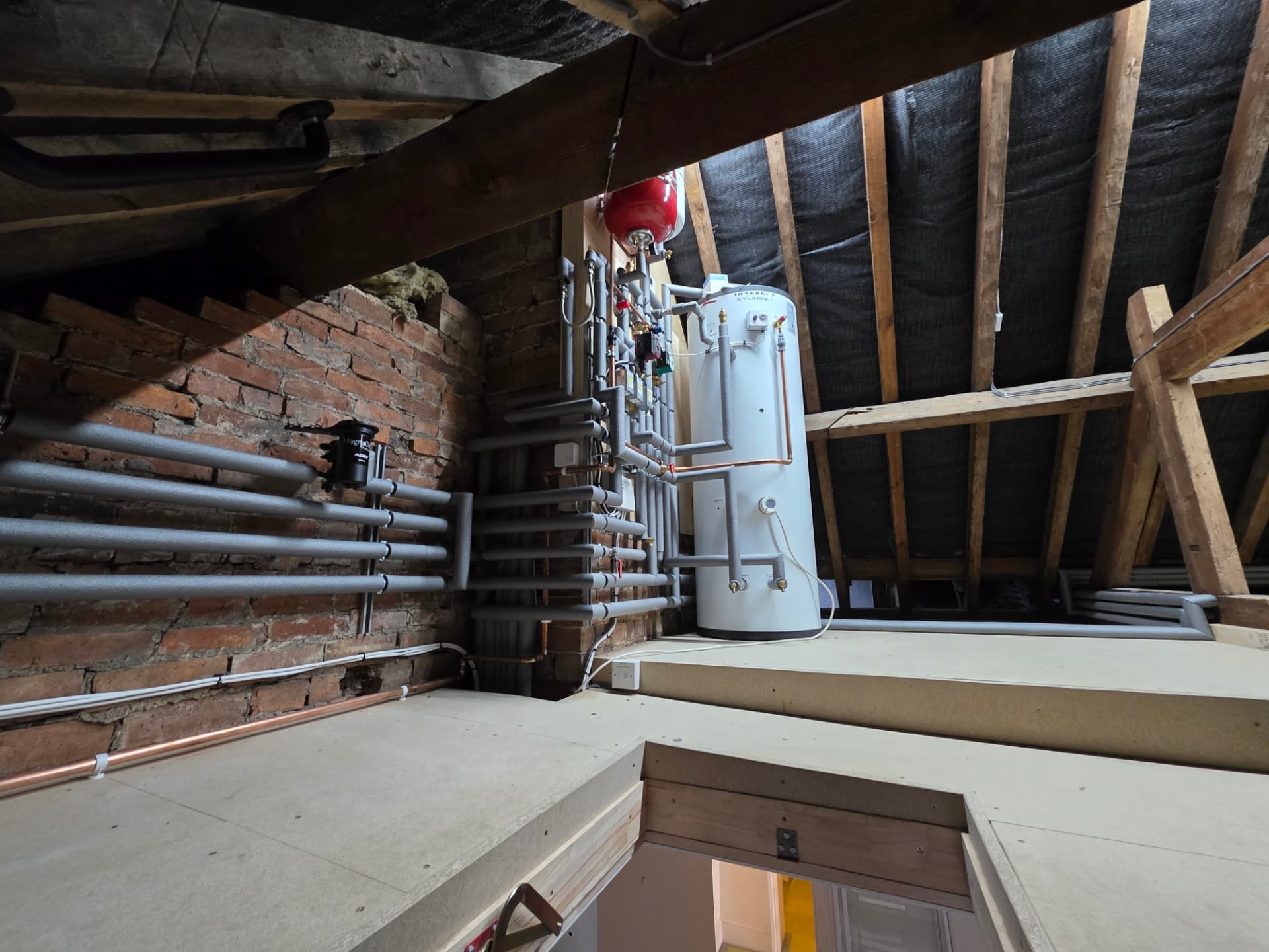 Wide view of an attic unvented cylinder installation with MagnaClean filter, Stratford-upon-Avon