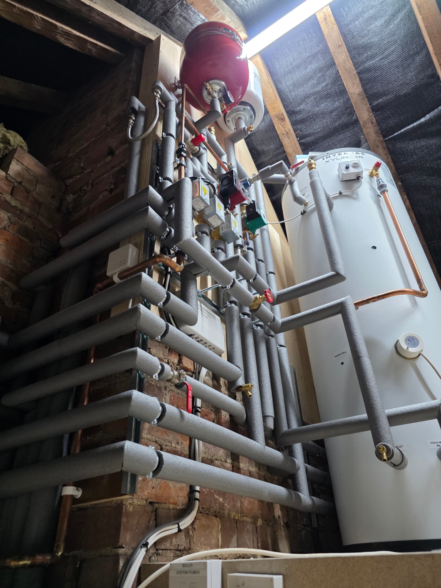 Detail of zone valves and insulated pipework on an Intergas Xylinder, Stratford-upon-Avon