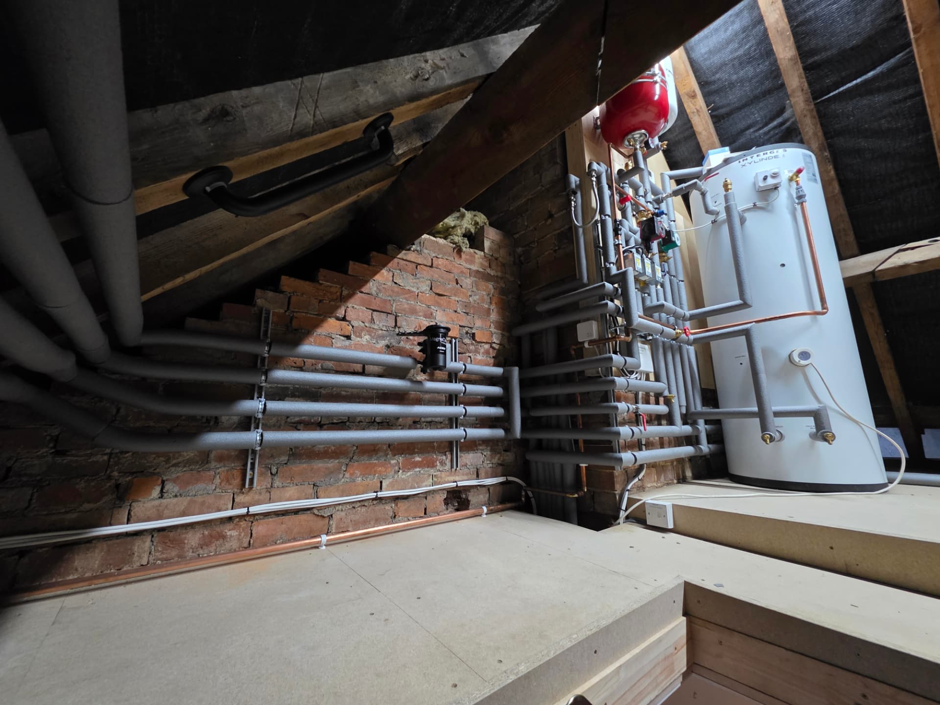 Attic unvented cylinder install with insulated flow-and-return manifold, Kenilworth