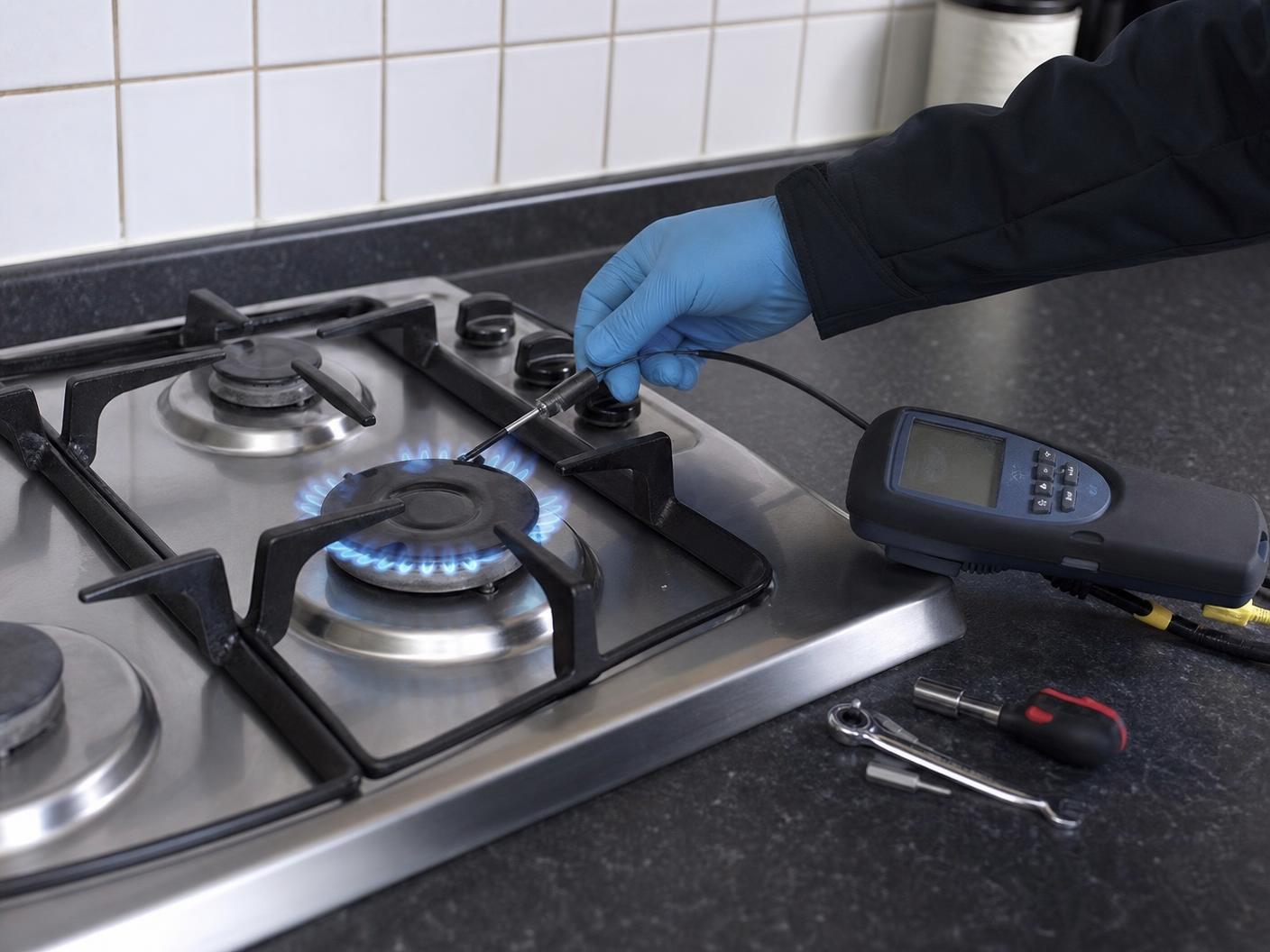 Gas Safe registered engineer testing an appliance in a Warwickshire home
